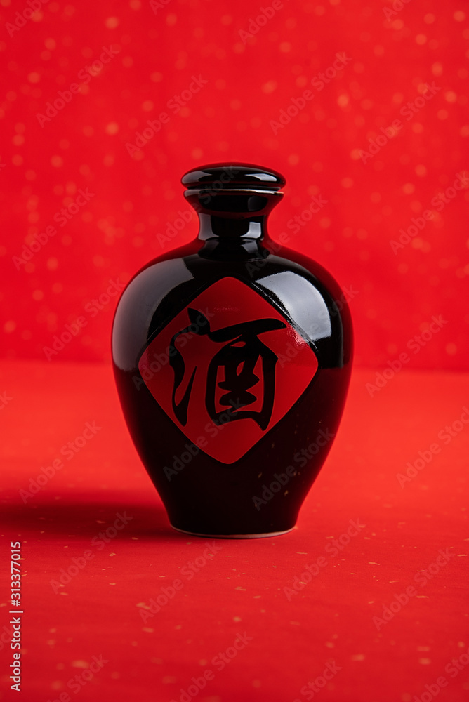 Chinese traditional brewed liquor in a jug on a red background