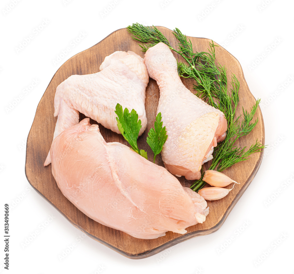 Board with raw chicken meat on white background