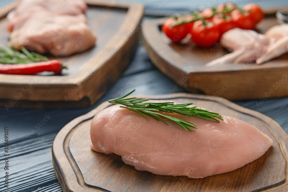 Raw chicken meat on wooden background