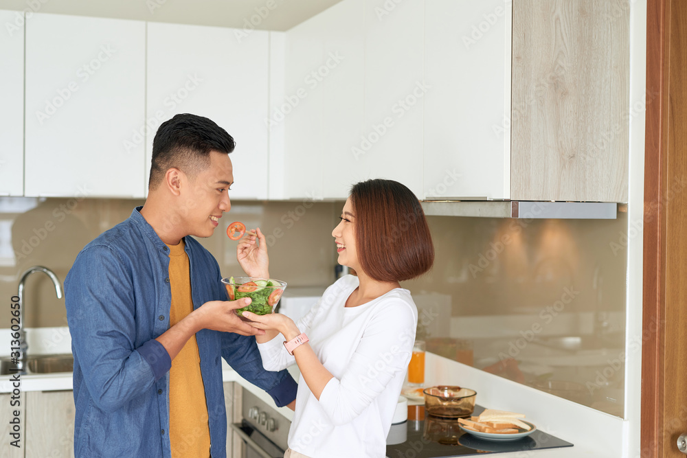 Asian Lovers feeding fruit and food to each other, Couple and Family concept.