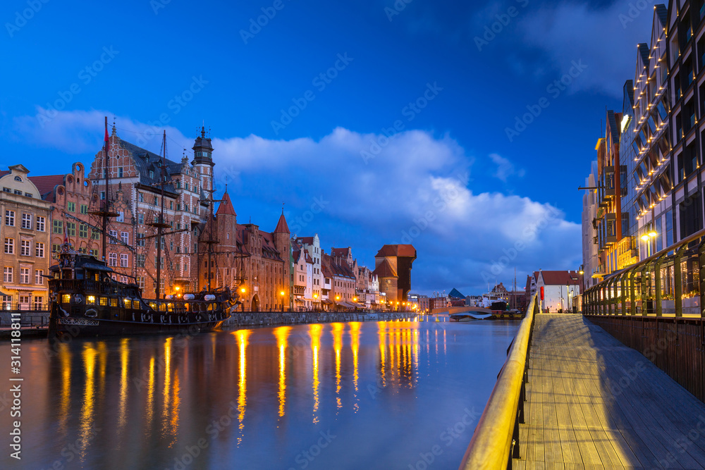 Beautiful scenery of the old town in Gdansk over Motlawa river at dawn, Poland.