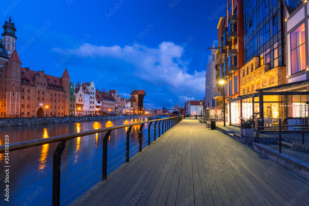 Beautiful scenery of the old town in Gdansk over Motlawa river at dawn, Poland.