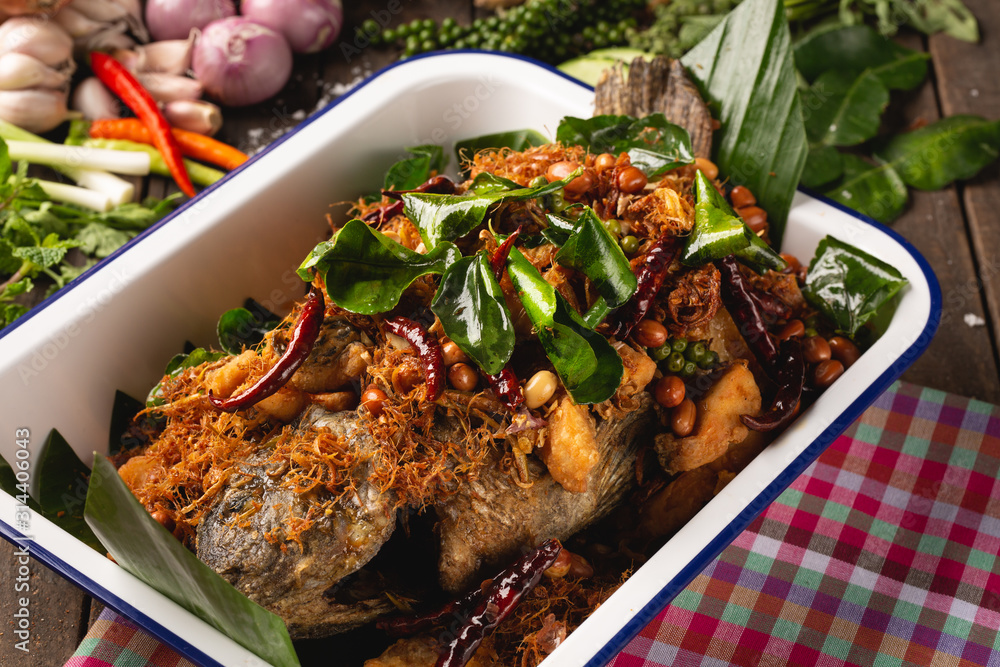 Fried Tubtim fish with herbs for health, [Isan food, Fried fish with herbs, Isan Thai food, Thai foo