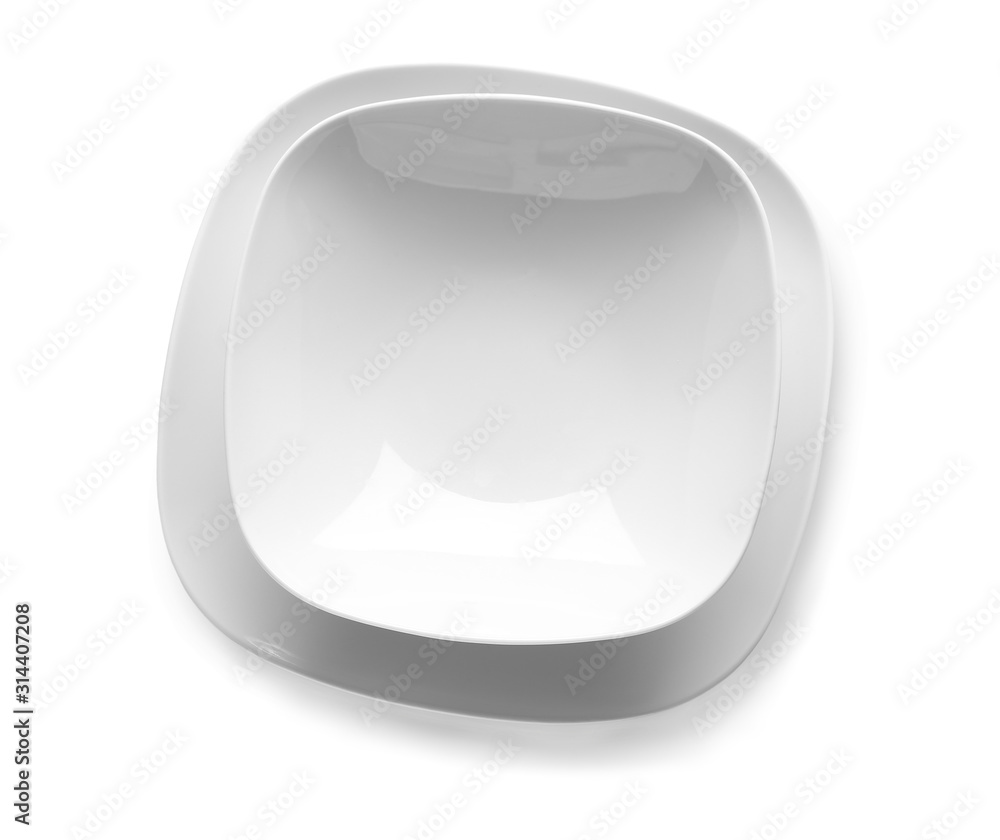 Empty ceramic plates on white background