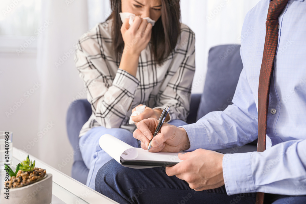 Psychologist working with woman in office, closeup