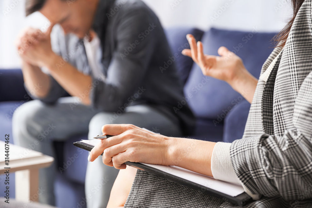 Psychologist working with patient in office, closeup