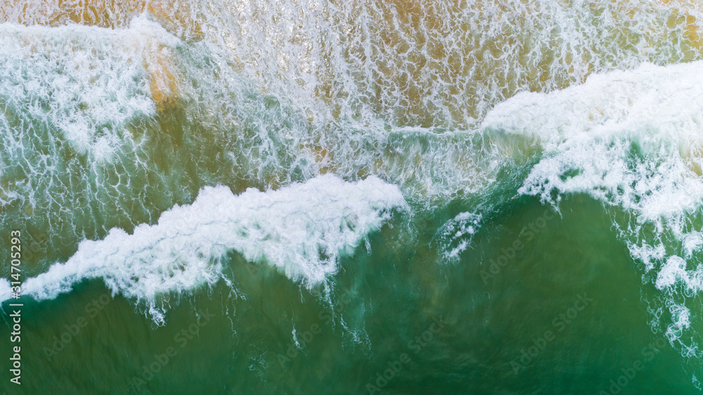 Top view nature landscape of Flowing wave white seafoam turquoise waves Beautiful tropical sea in su