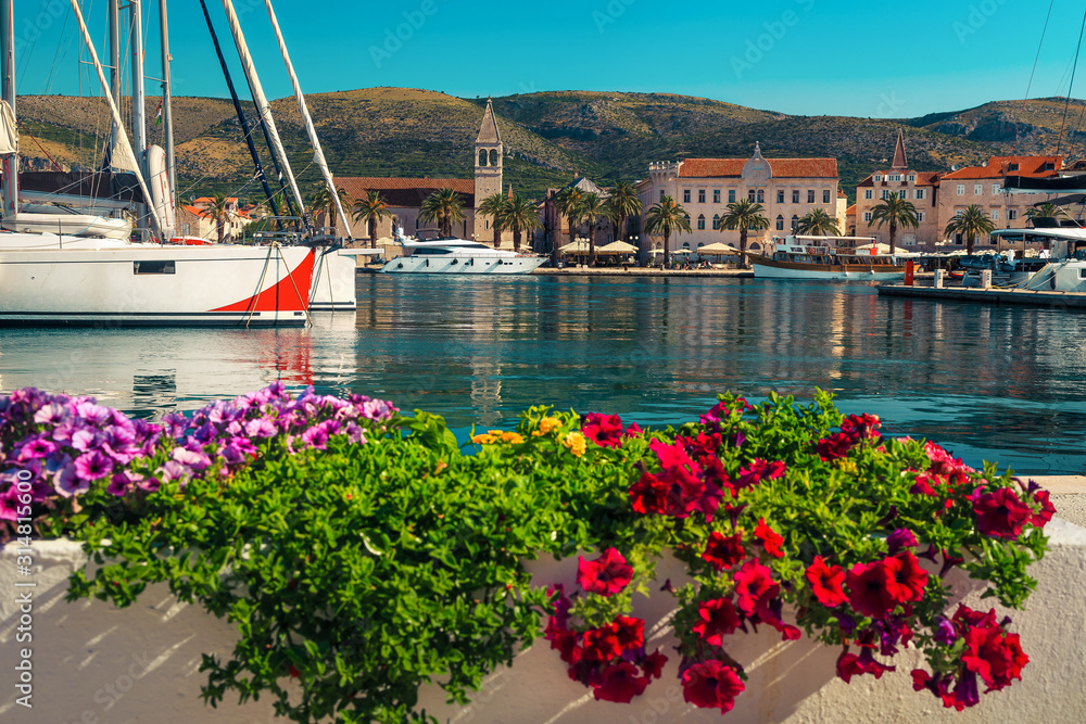 Cityscape with walkway and luxury boats in harbor, Trogir, Croatia