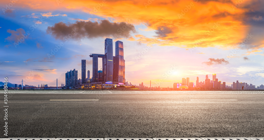 Empty asphalt road and city skyline with buildings in Chongqing at sunset,China.