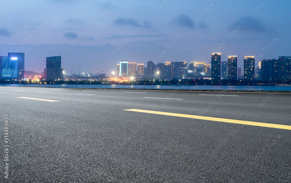 Road surface and urban architectural landscape skyline