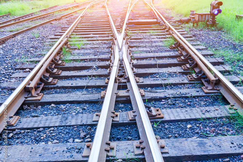 Close up low down view of railway train transport metal steel rails.