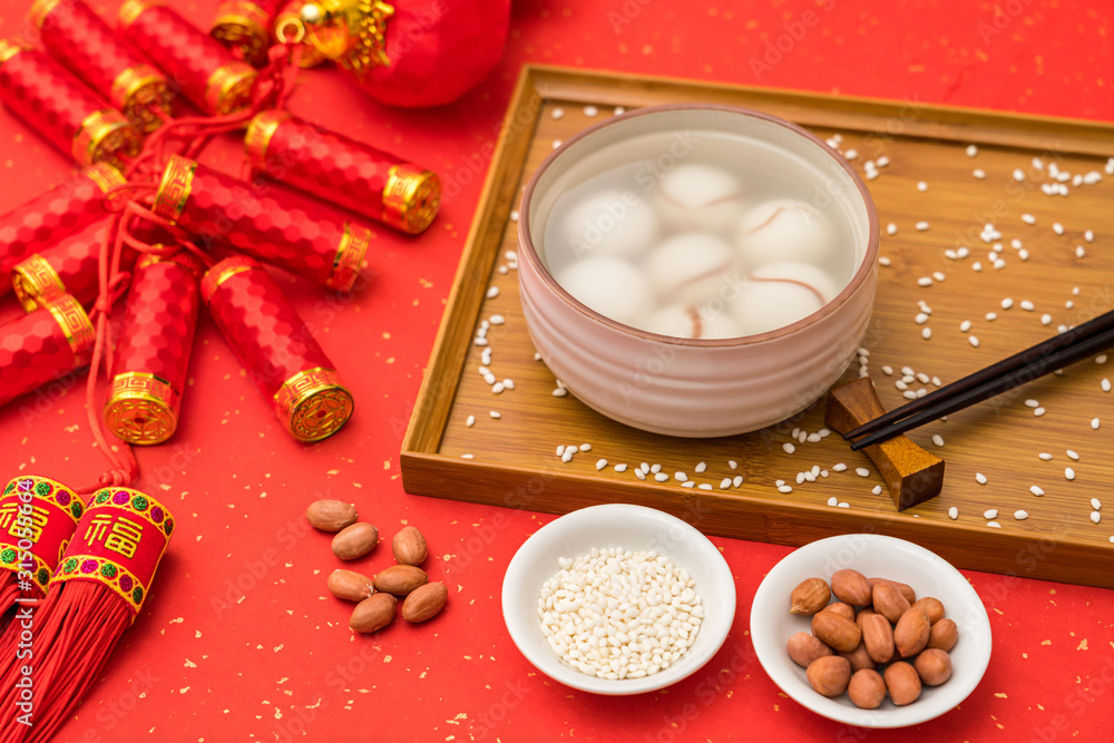 Chinese Lantern Festival traditional cuisine peanut dumplings on red background