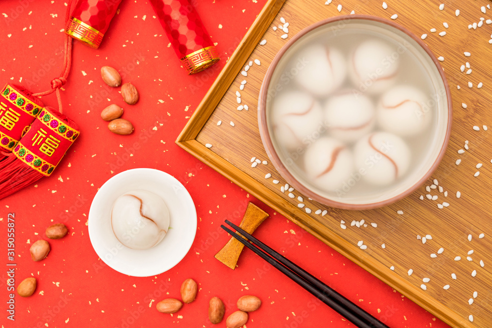 Chinese Lantern Festival traditional cuisine peanut dumplings on red background