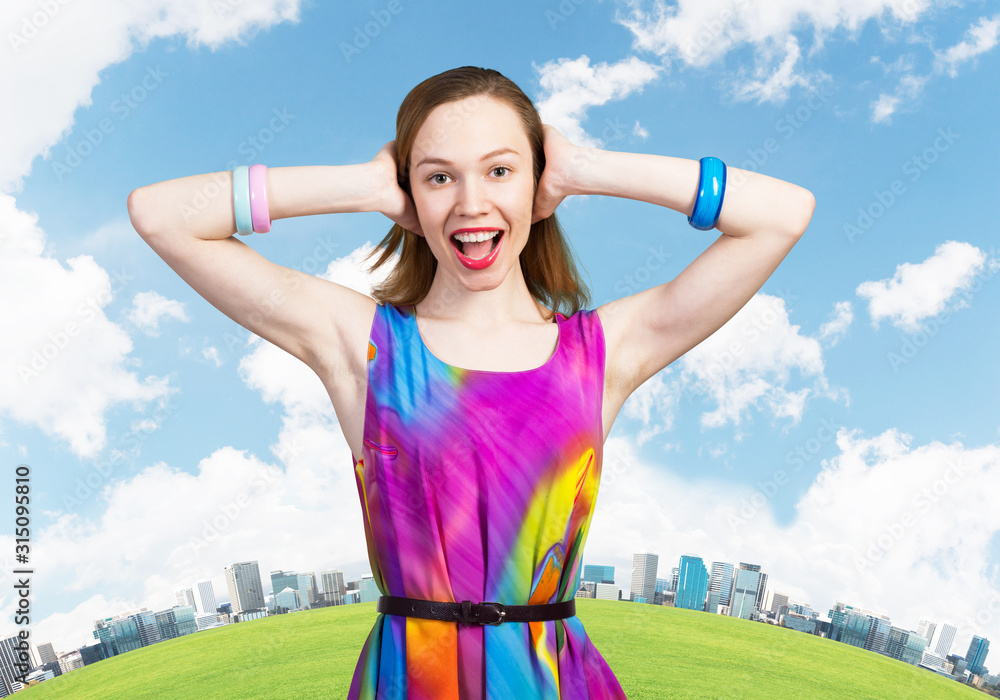 Redhead european girl closing her ears with hands