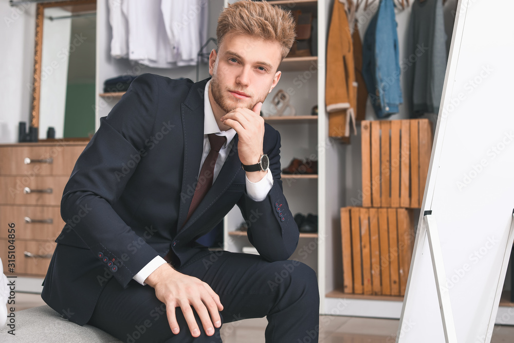 Stylish young man in dressing room