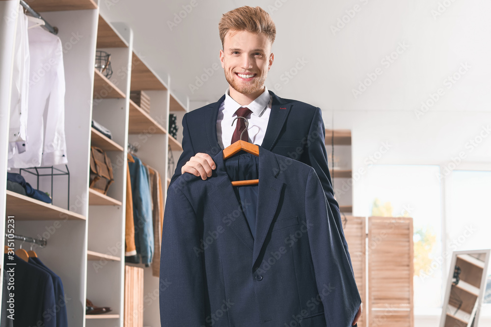 Handsome man with stylish clothes in dressing room