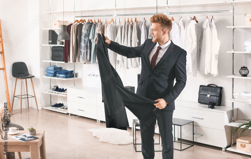 Handsome man with stylish clothes in dressing room