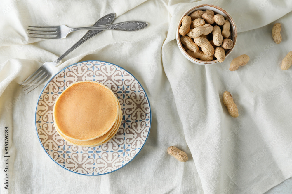 Composition with tasty pancakes on table