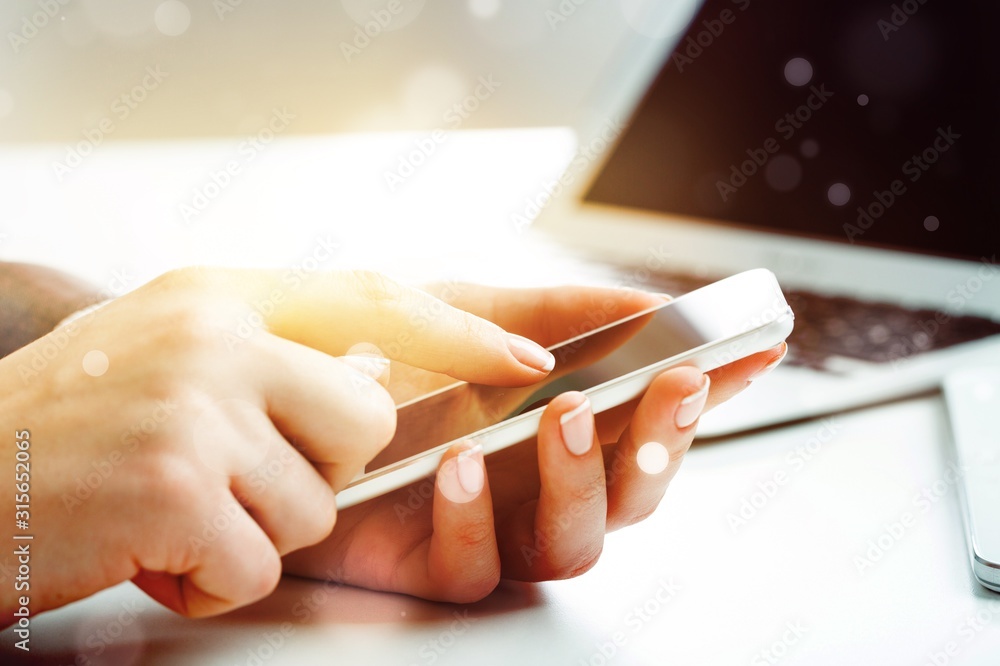 Man holding a credit card and typing. On-line shopping on the internet using a laptop