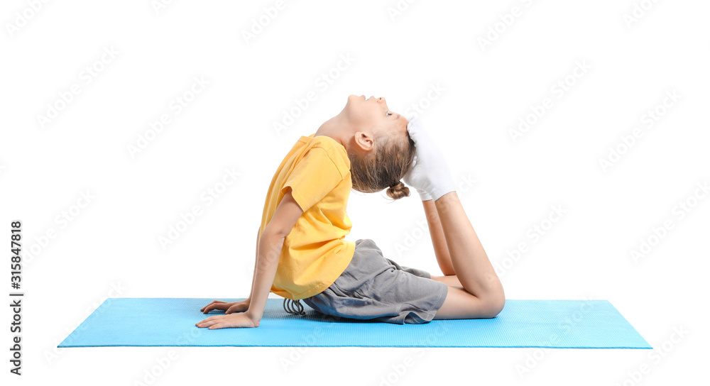 Little girl practicing yoga on white background