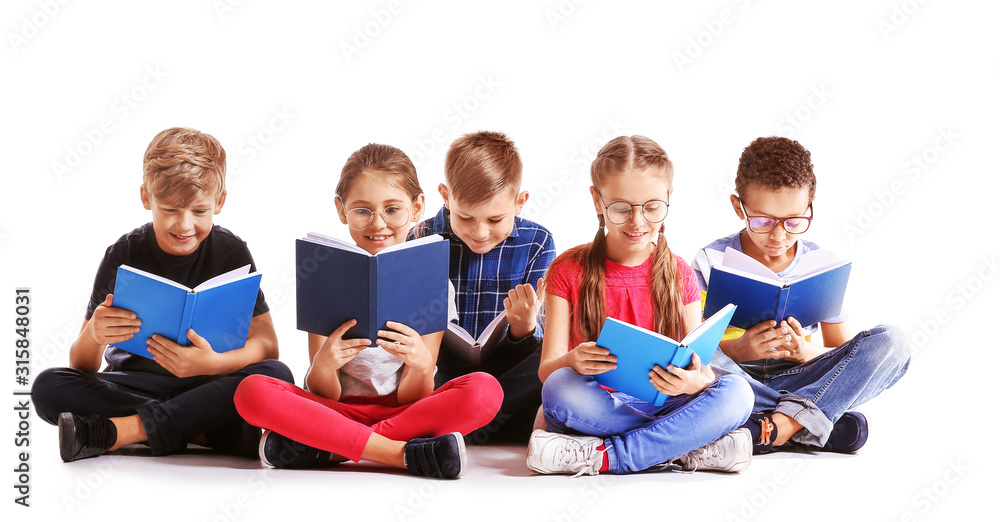 Cute little children reading books on white background