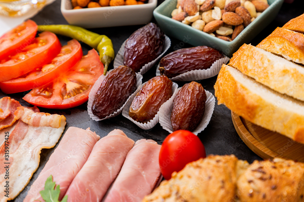 Breakfast on the table. Croissant bread, Croissant cereal, Bacon, ham, cheese, lettuce, beans, corn 