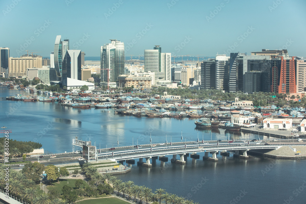 Aerial view of Deira and Dubai Creek in the old Dubai on a sunny day. Dubai, United Arab Emirates.