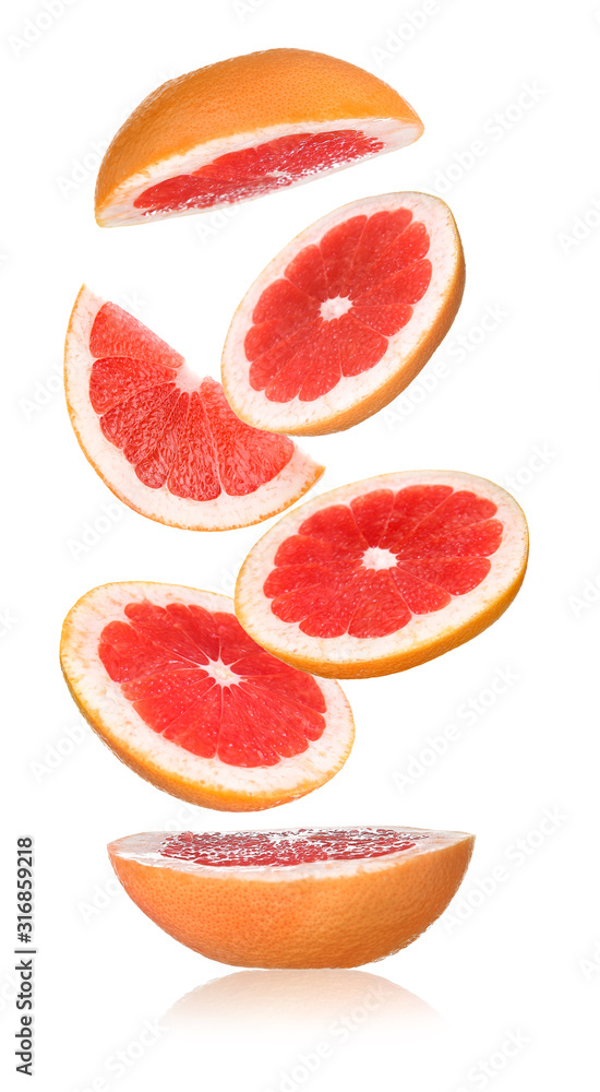 Flying cut grapefruit on white background