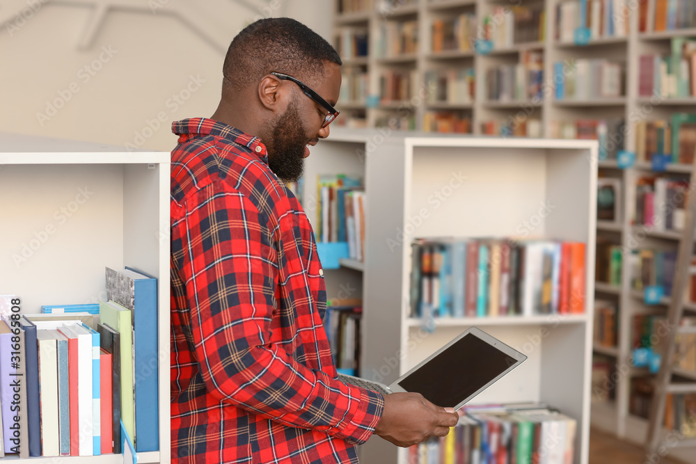 African-American student preparing for exam in library