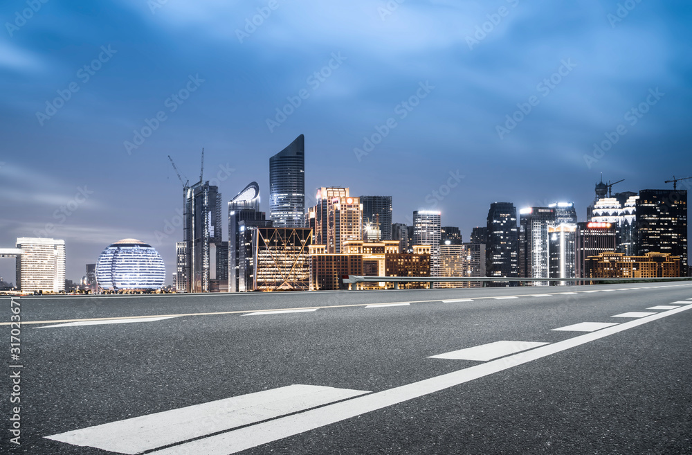 Urban road and night view of Hangzhou architectural landscape..