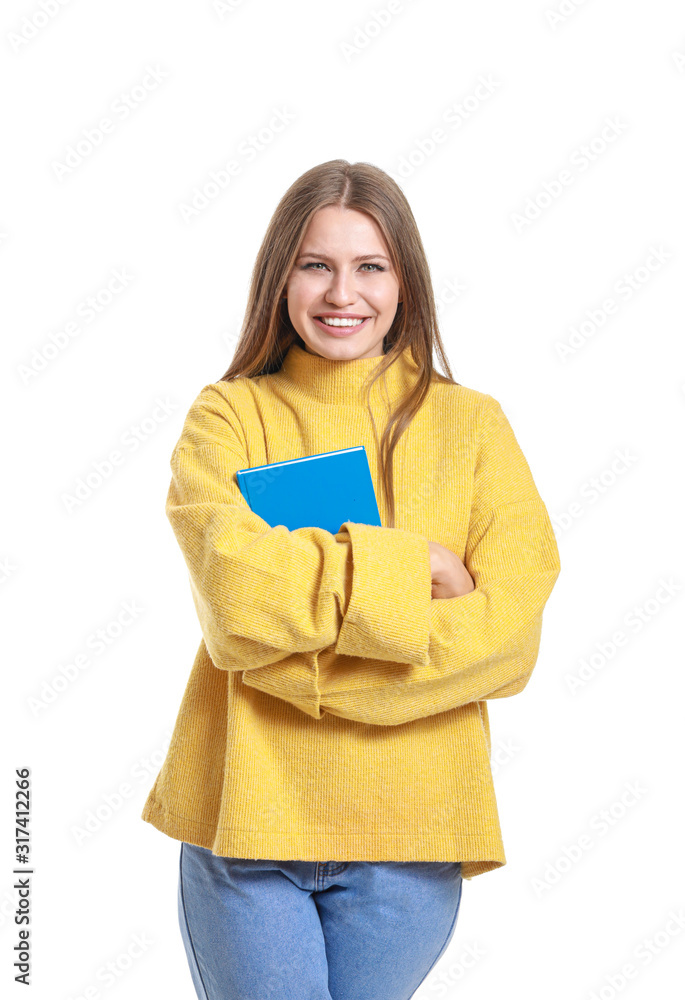 Beautiful young woman with book on white background