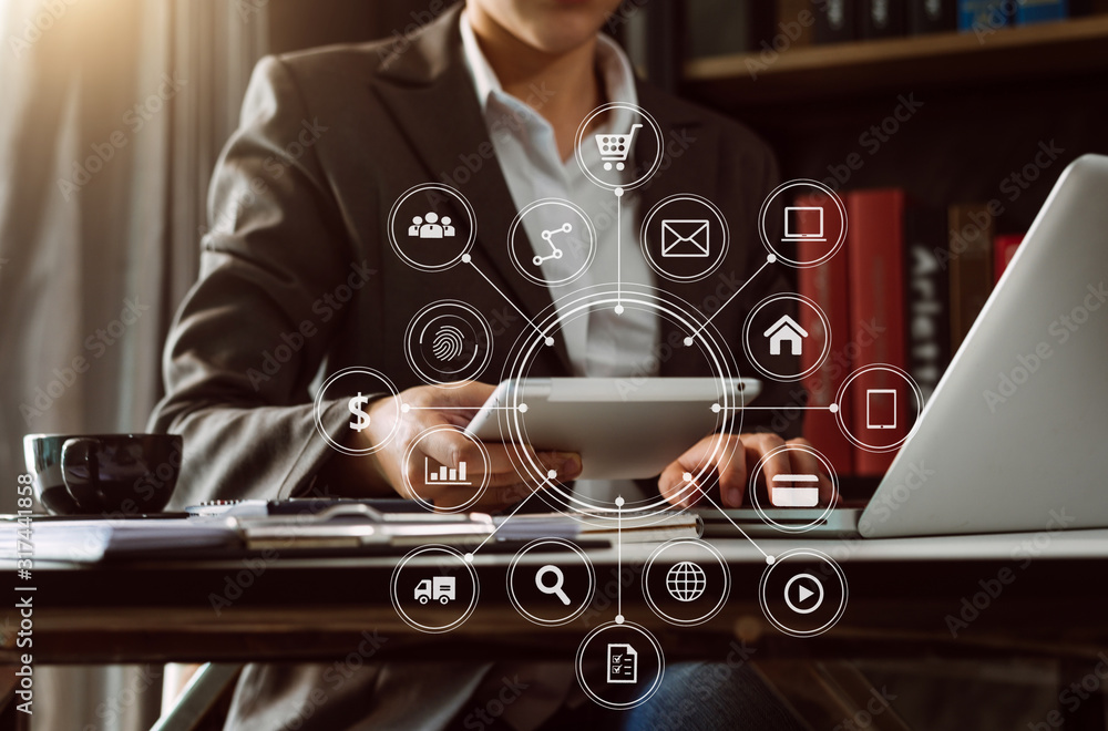 Businessman hand using laptop, tablet and smartphone  in office. Digital marketing media mobile app 