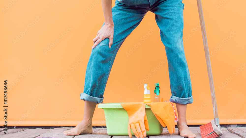 Woman with house supplies ready to clean room. Spring cleaning