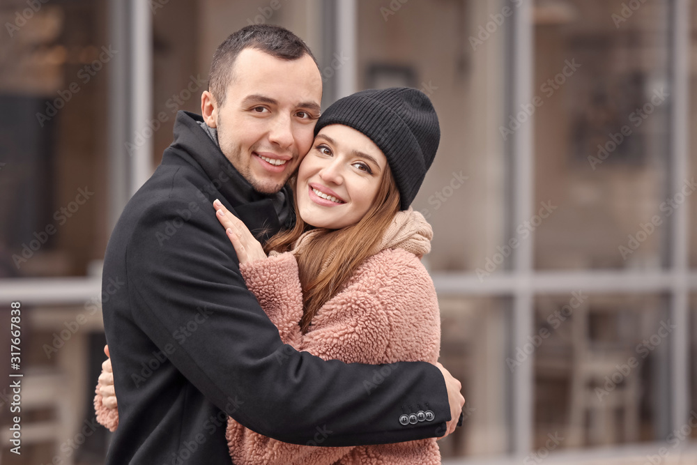 Portrait of happy young couple on romantic date outdoors