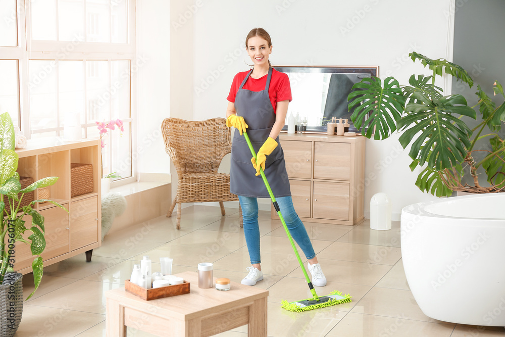 Janitor doing cleanup in bathroom