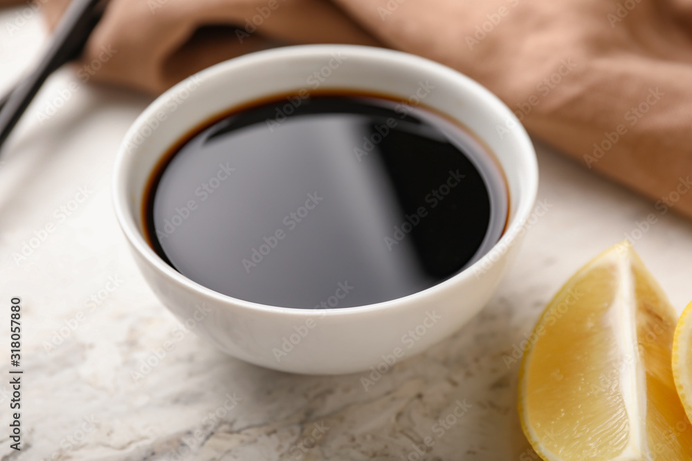 Bowl with tasty sauce on table