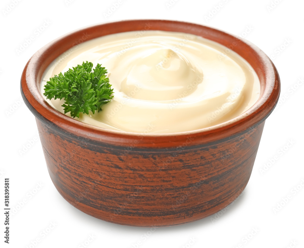 Bowl of tasty sauce on white background