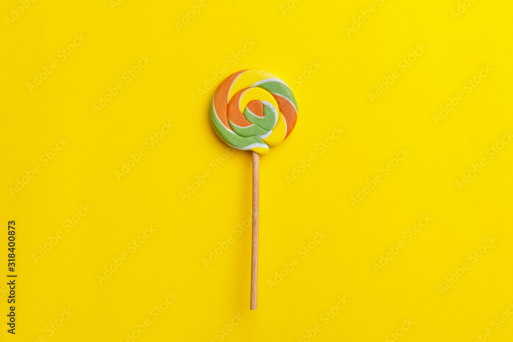 Tasty lollipop on color background