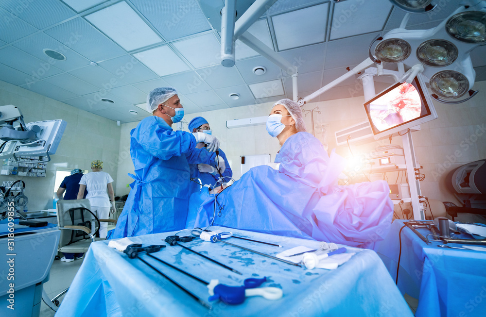 Team surgeon at work in operating room. Modern equipment in operating room. Medical devices for neur