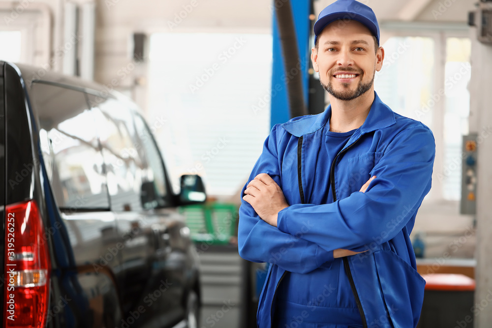 Male mechanic in car service center