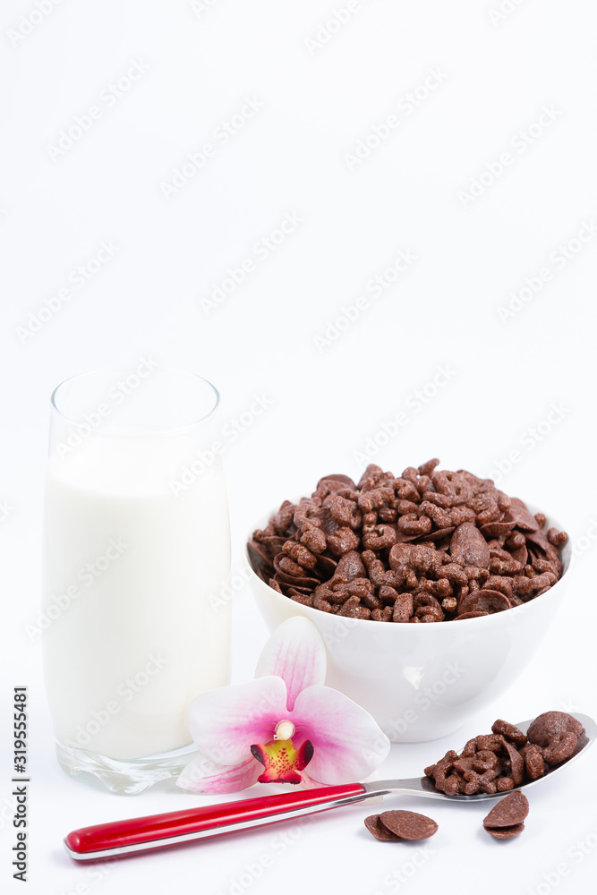 Breakfast cereal, cornflake chocolate in cups and milk is a healthy breakfast that is healthy for th