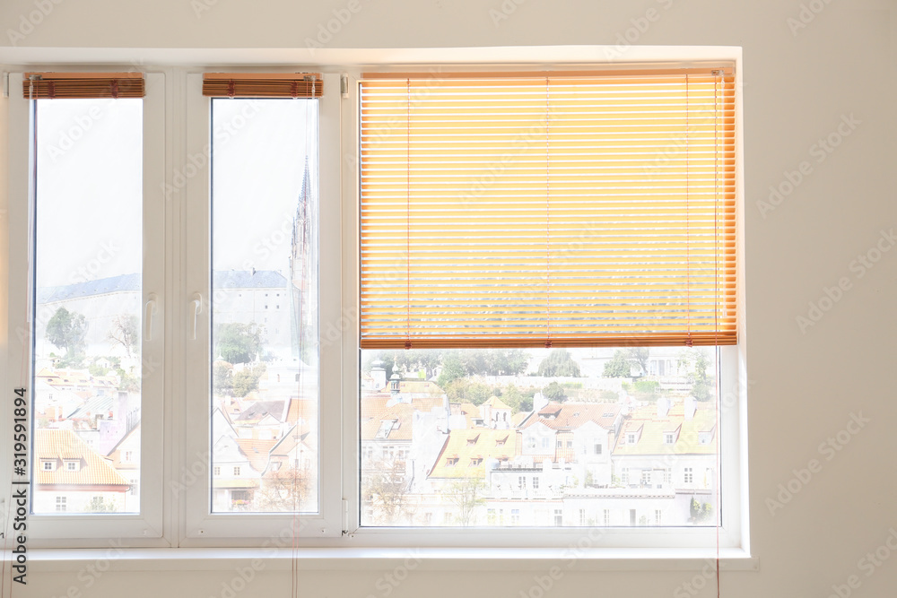 Modern blinds hanging on window