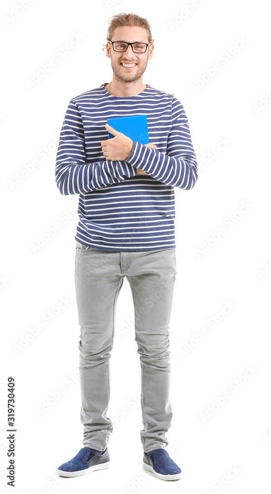 Handsome man with book on white background