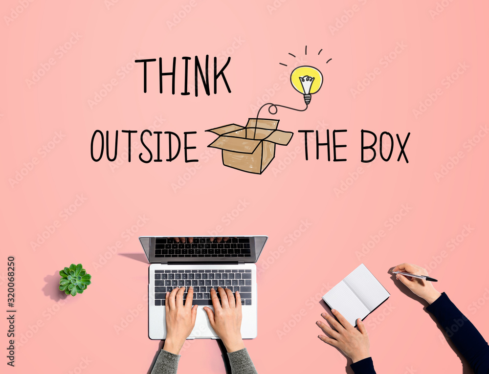 Think outside the box with people working together with laptop and notebook