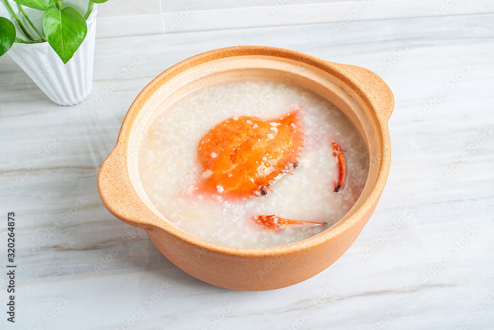 Chinese Chaoshan casserole porridge, a pot of shrimp and crab seafood porridge on the kitchen counte