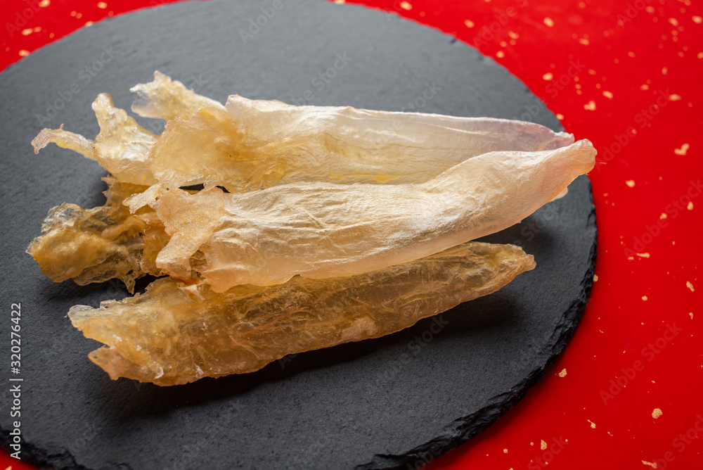 Traditional health nourishing food Maw, catfish glue on slate tray