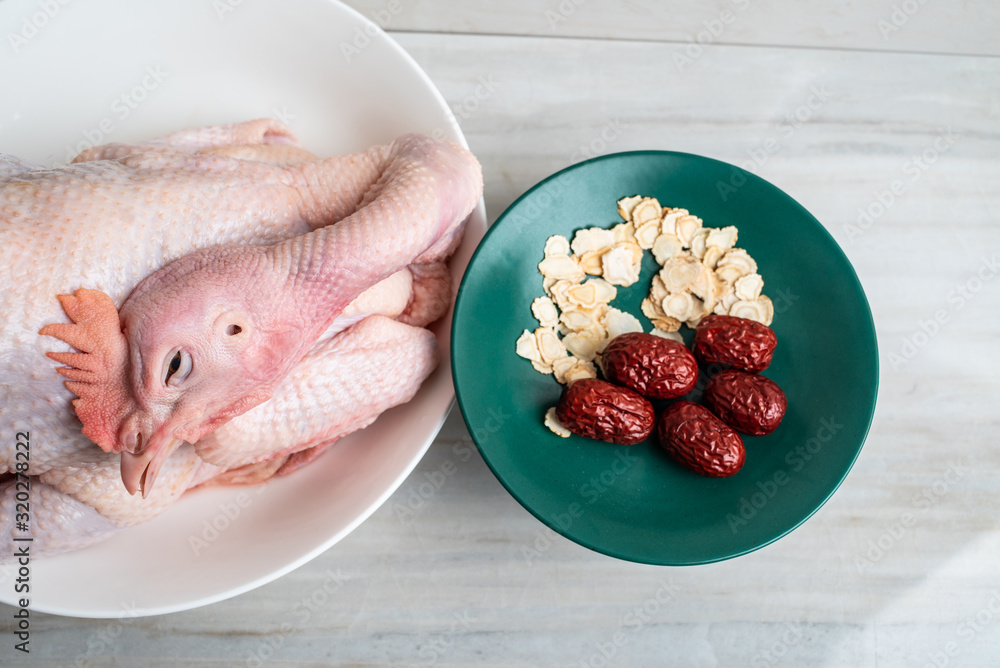 Chinese medicated health soup ingredients, fresh hens and red ginseng and red dates