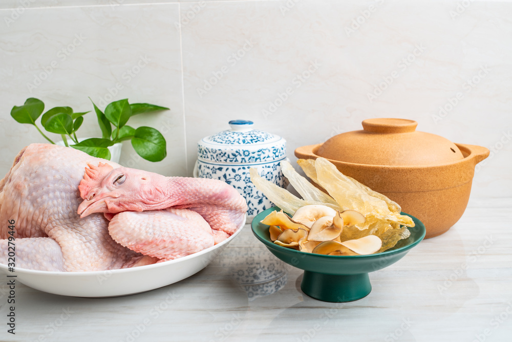 Ingredients of Chinese tonic health soup, fresh hen and snail shell