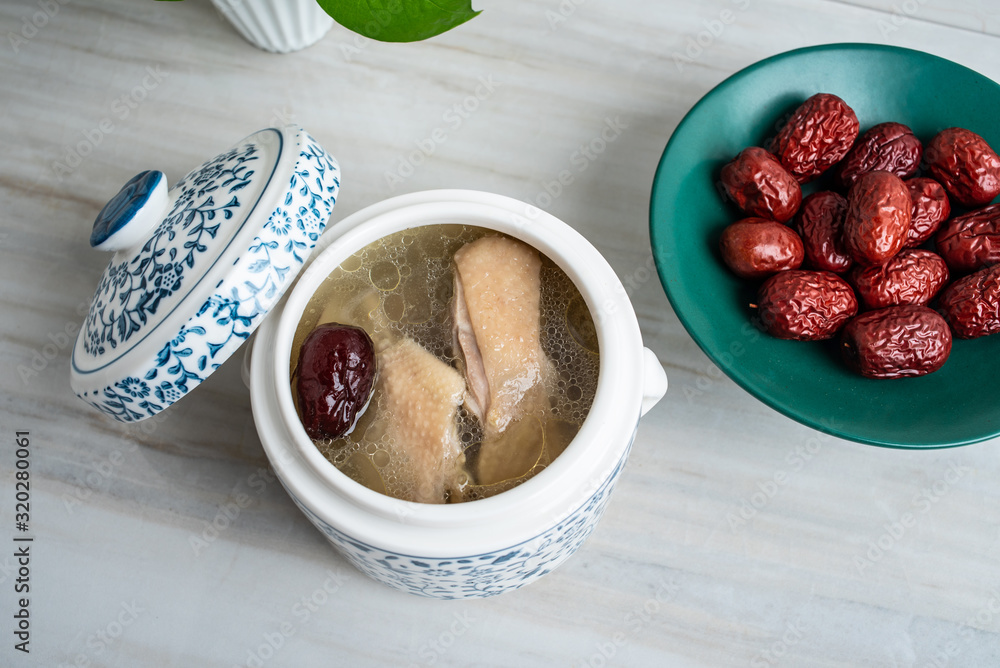 Chinese health tonic soup, stewed chicken soup with red dates