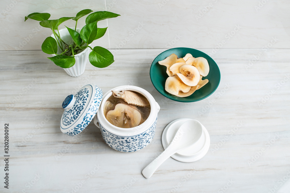 Chinese health tonic soup, stewed chicken soup with ring snails